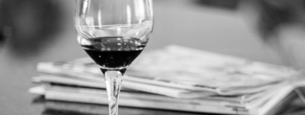 Image of a wine glass + magazines